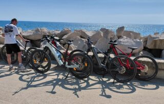 Tourist with an e-bike standing on the rocky coast near Obzor Bulgaria
